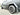 Gray front mud flap with wheel-side coverage on Cybertruck, close-up