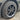 Gunmetal wheel rim protector fitted on a multi-spoke alloy wheel