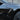Carbon-fiber side camera trim cover with silver multi-slat detailing