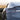 SpaceX rear emblem badge on car, chrome letters with glossy finish