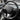 Carbon fiber sport steering wheel, black perforated rim with carbon fiber spokes.