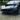 Front lip spoiler kit for Tesla Model 3 installed on dark car—black lower front lip