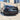 Rear bumper diffuser with red LED brake light detail and black trim.