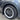 Dark gray wheel rim protector fitted on a multi-spoke alloy wheel
