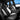 Front-row custom leather seat covers with black surfaces and white accent trim