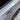 A view of carbon fiber textured door handle add-on parts installed on a Tesla Model Y