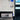 4-port USB hub mounted in a car area near the screen, with one blue USB port