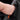 Hand installing orange Alcantara door handle wrap inside car door