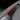 Red Alcantara door handle wrap strip on gray interior trim with protective edge