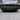 Tesla Model 3 carbon fiber rear diffuser installed under rear bumper with fins