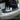 Smart trunk cooler open in car trunk with ice box divider and drinks inside