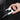 Hand placing silver rear seat rail corner protector on black mounting track