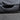 Black stitched door protection pad covering the lower door panel area