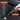 Black velvet-style kick protector pad with hook-and-loop velcro attachment points