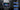 Car rear entertainment screen with streaming thumbnails and built-in speaker area