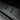 Trunk sill plate cover with carbon-fiber pattern insert and blue edge trim