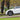 Wheel cover on car wheel in gun gray, multi-spoke pattern with center hub