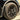 Gun gray turbine center wheel cover with multi-spoke design and visible tire