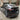 4-piece carbon fiber aero upgrade kit installed on black car, rear and side trim