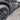 Carbon fiber side skirt add-on for Tesla Model Y, close-up near front wheel