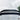 Carbon fiber rear spoiler with black lip, mounted on vehicle rear hatch