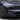 Matte black fog light trim cover with layered edge styling on bumper