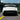 Black rear diffuser panel with side fins and integrated lower bumper accents
