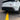 Matte black rear diffuser side fins beneath bumper with vented shapes