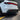 Matte black rear diffuser fins and lower bumper trim near taillight