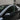 Side window rain visor with dark aerodynamic trim on the Tesla Model Y door window