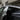 Rear side window rain guard visor with dark trim, curved for the Tesla Model Y