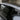 Side window visor rain guard along the Tesla Model Y door glass with dark edging