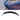 Glossy black trunk spoiler wing, close-up of curved lip and mounting edge