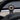 Tesla wireless charging phone mount, round copper-ring charging plate on dashboard