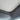 Grey sunroof sunshade panel with curved edge and dark trim