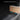 Trunk sill plate cover installed in open trunk sill, black textured surface
