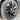 Close-up wheel cover on tire, dark spokes with silver ring and center hub