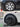Car wheel cover before-and-after on rim, silver spokes with black trim