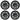 Four black multi-spoke wheel covers with circular center caps and small silver spoke accents.