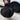 Wheel cover storage carrying bag, black, with handles, holding a wheel