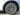 Close-up of dark multi-spoke wheel cover with center cap and lug area
