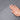Hand pressing dark gray suede-style air mattress fabric texture