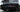 Black rear bumper diffuser with integrated fins and parking sensor holes