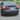 Tesla rear view showing black rear diffuser with finned trim under the bumper
