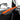 Orange Alcantara door panel trim insert with red ambient accent line along the door panel.