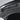 Close-up of installed trunk lid protector mat with molded knobs and latch cutout.