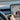 Turn signal lever kit on steering column, hand adjusting the stalk lever.
