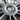 Wheel cover center cap close-up with YEYLAK logo on dark spokes