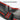 Close-up of black trunk sill protector with textured tread and red adhesive stripes