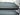 Close-up of dashboard cover seams and blue edge piping